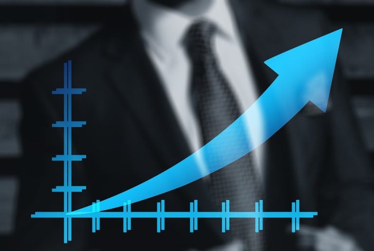 Increasing business growth with upward trending graph and arrow in a professional setting.