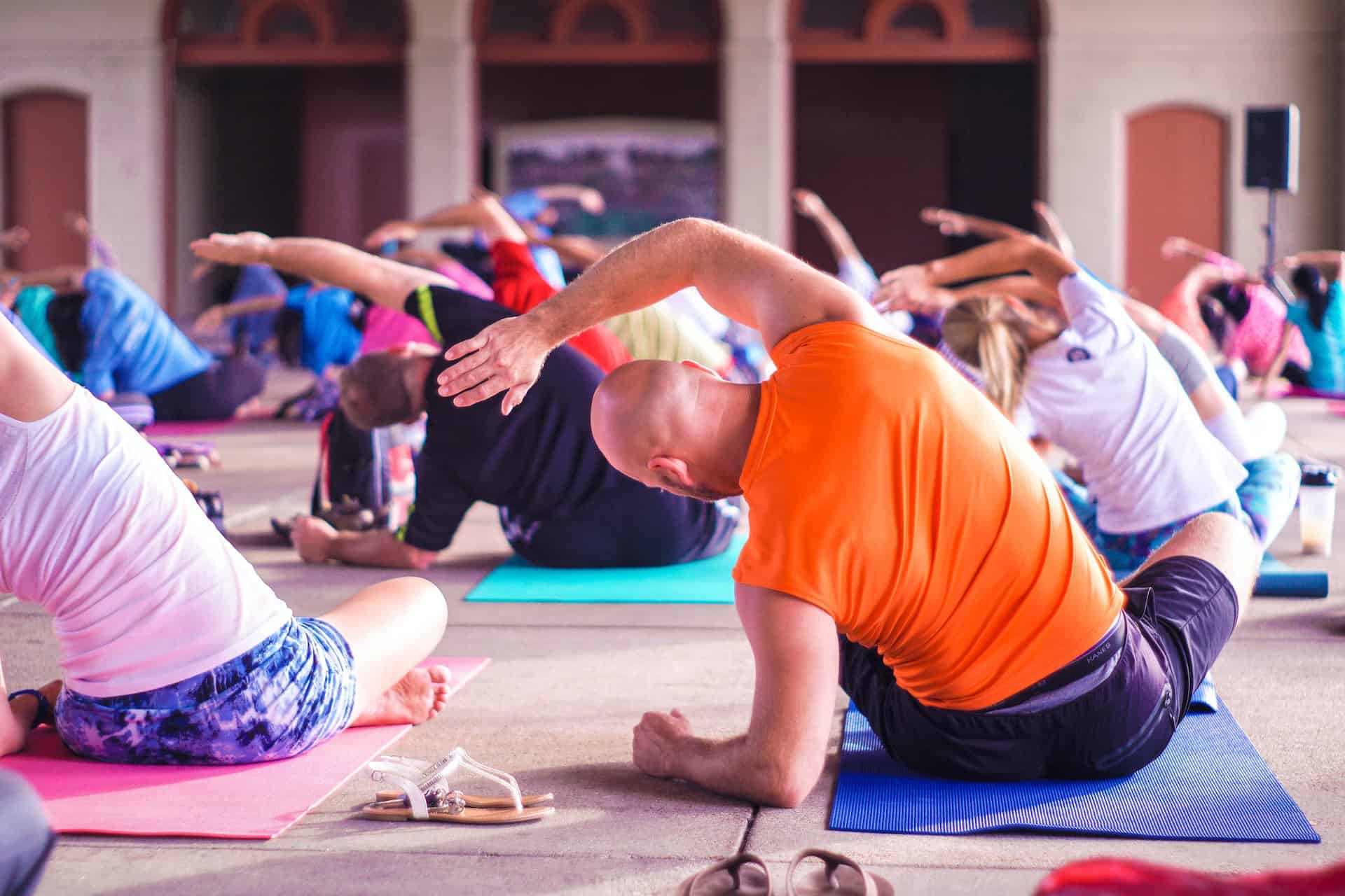 Group yoga class at Brixx, focusing on flexibility and relaxation.