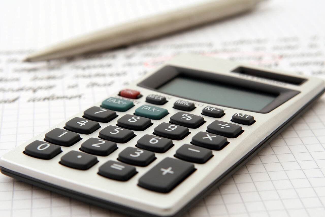 Office calculator on graph paper for financial calculations and budgeting.