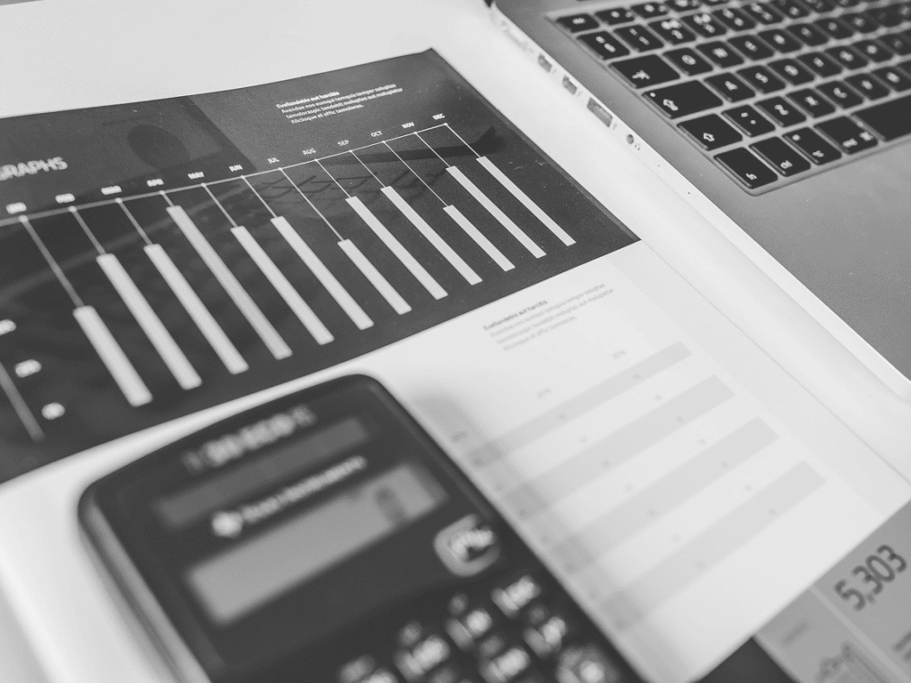 Profit and sales data analysis on a laptop and smartphone for Brixx restaurant business.